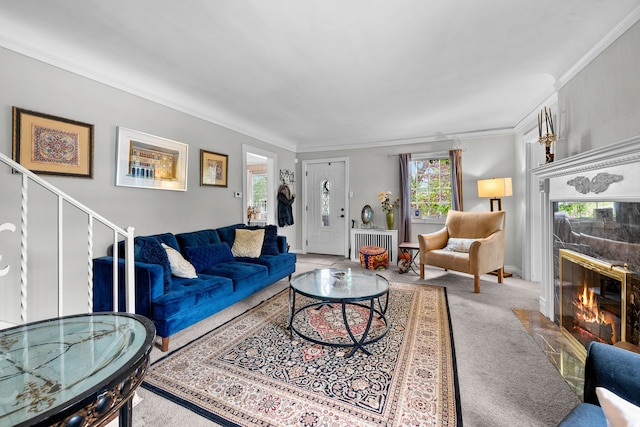 8911 Manor Ave, Allen Park, MI 48101 - living area with ornamental molding, radiator, healthy amount of natural light, a premium fireplace, and carpet floors