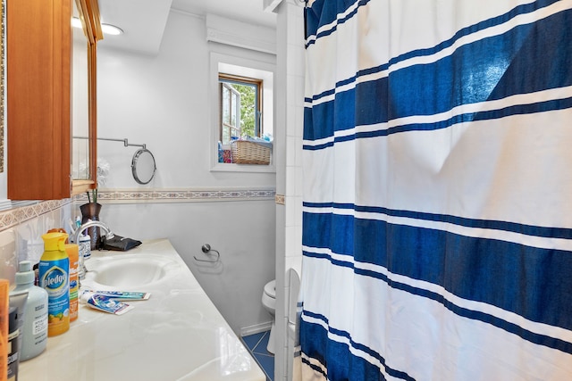 8911 Manor Ave, Allen Park, MI 48101 - bathroom featuring toilet, tile walls, vanity, and curtained shower