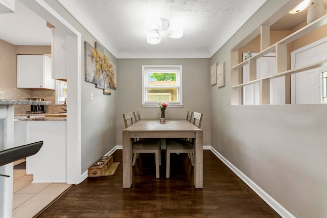 23830 Shakespeare Ave, Eastpointe, MI 48021 - dining area with dark wood finished floors and baseboards