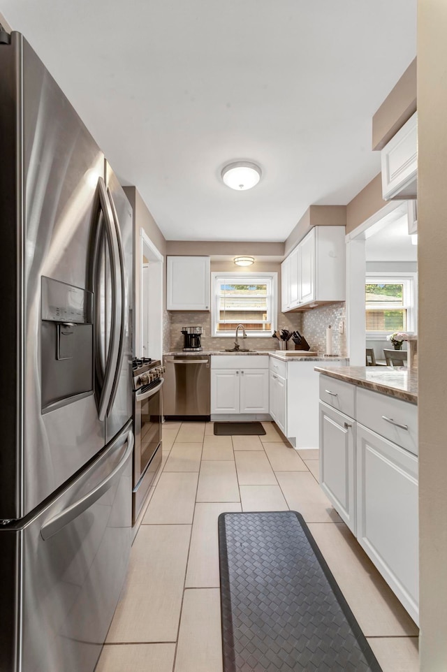 23830 Shakespeare Ave, Eastpointe, MI 48021 - kitchen with stainless steel appliances, a sink, backsplash, and healthy amount of natural light