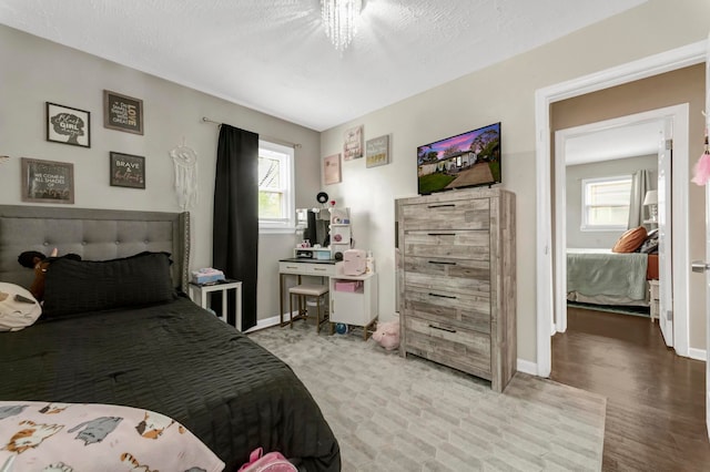 23830 Shakespeare Ave, Eastpointe, MI 48021 - bedroom featuring multiple windows and baseboards