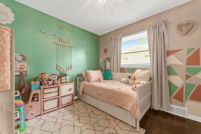 23830 Shakespeare Ave, Eastpointe, MI 48021 - bedroom with wood finished floors and baseboards