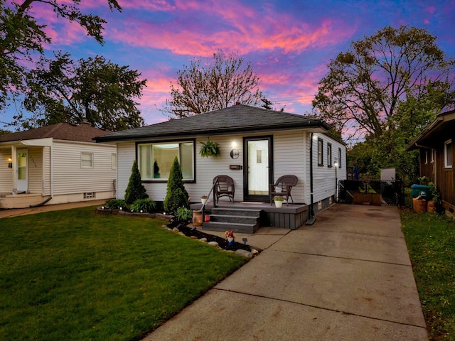 23830 Shakespeare Ave, Eastpointe, MI 48021 - view of front of home featuring a yard, roof with shingles, and driveway