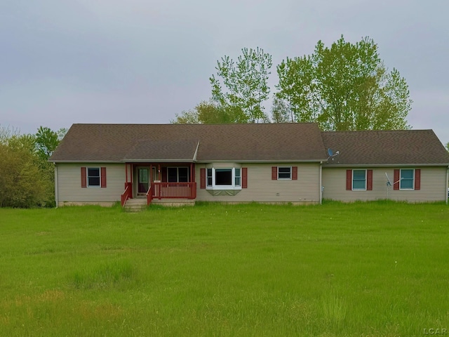 9421 Springville Hwy, Onsted, MI 49265 - ranch-style house with a porch and a front lawn