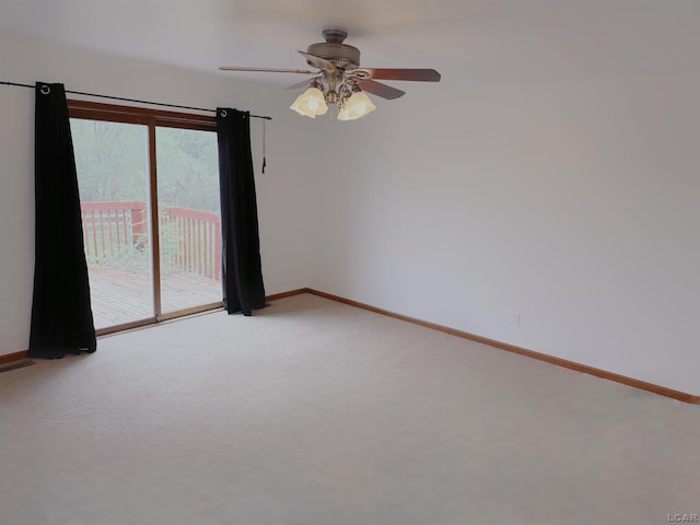 9421 Springville Hwy, Onsted, MI 49265 - unfurnished room with light carpet, baseboards, and a ceiling fan