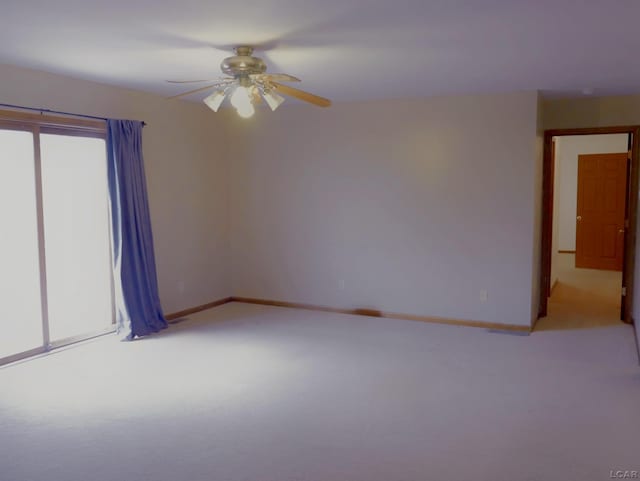 9421 Springville Hwy, Onsted, MI 49265 - empty room with light carpet, ceiling fan, and baseboards