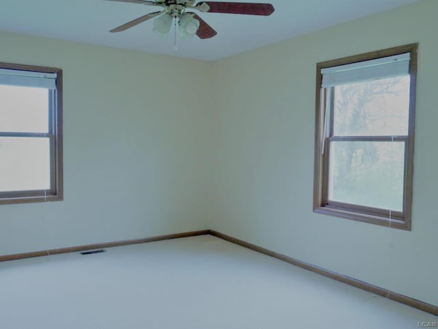 9421 Springville Hwy, Onsted, MI 49265 - empty room with healthy amount of natural light, ceiling fan, carpet floors, and baseboards