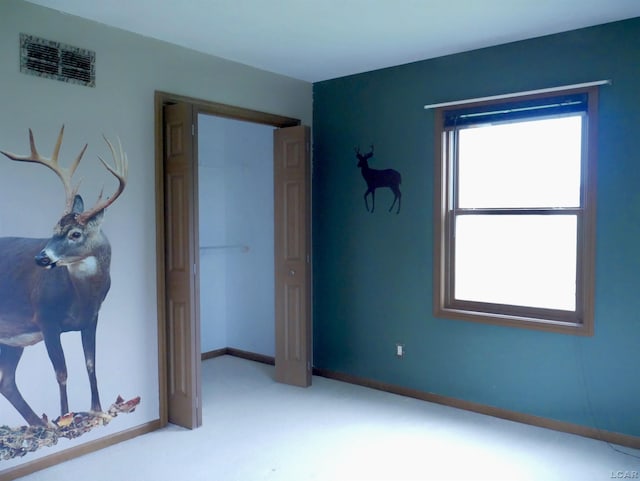 9421 Springville Hwy, Onsted, MI 49265 - unfurnished bedroom featuring carpet floors, a closet, and baseboards