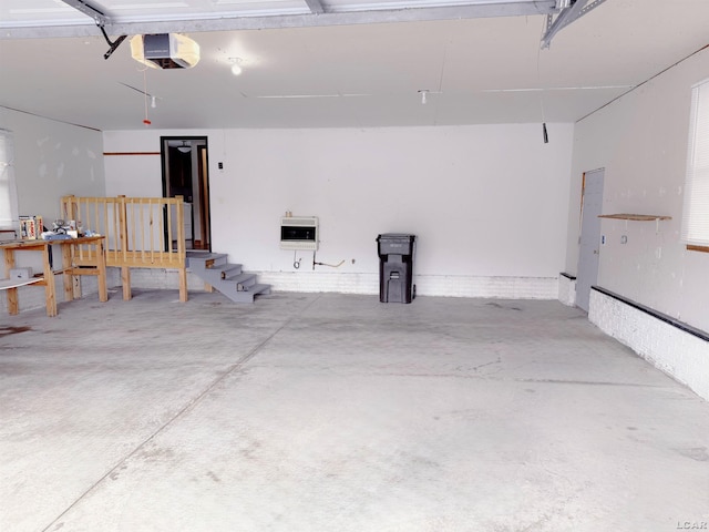 9421 Springville Hwy, Onsted, MI 49265 - garage featuring a garage door opener and heating unit