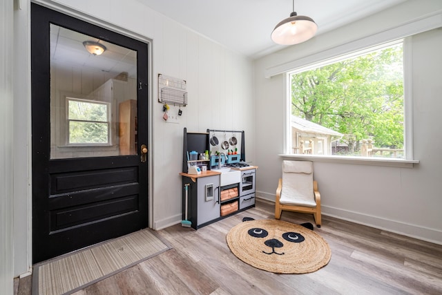 5915 S Pipestone Rd, Eau Claire, MI 49111 - living area featuring light wood-style floors, healthy amount of natural light, and baseboards