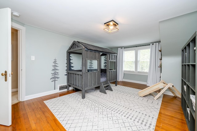 5915 S Pipestone Rd, Eau Claire, MI 49111 - bedroom with baseboards and hardwood / wood-style floors
