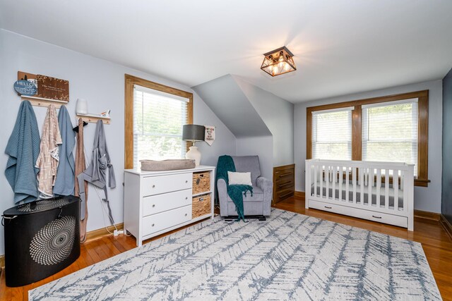 5915 S Pipestone Rd, Eau Claire, MI 49111 - bedroom featuring wood finished floors, baseboards, and vaulted ceiling