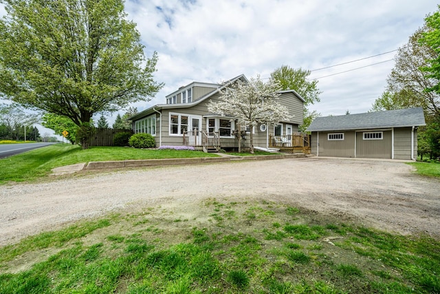 5915 S Pipestone Rd, Eau Claire, MI 49111 - view of front of property featuring an outbuilding, driveway, and a wooden deck