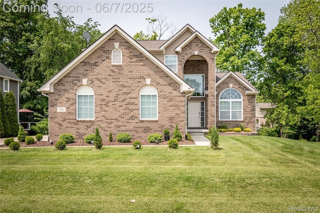 791 Glen Meadows Dr, South Lyon, MI 48178 - view of front of home featuring brick siding and a front lawn