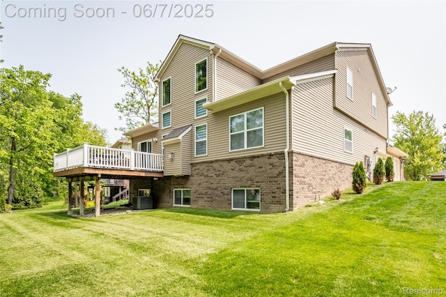 791 Glen Meadows Dr, South Lyon, MI 48178 - back of house featuring a deck, a lawn, brick siding, and cooling unit