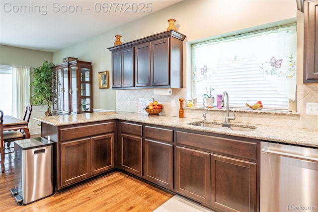 791 Glen Meadows Dr, South Lyon, MI 48178 - kitchen with dishwasher, a sink, a peninsula, and healthy amount of natural light