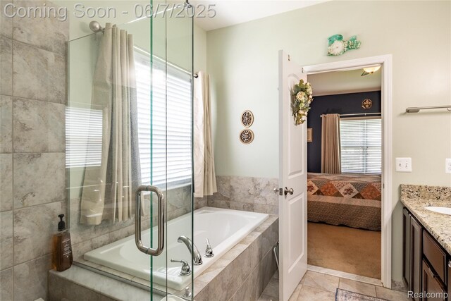 791 Glen Meadows Dr, South Lyon, MI 48178 - ensuite bathroom featuring vanity, a garden tub, tile patterned floors, and an enclosed shower