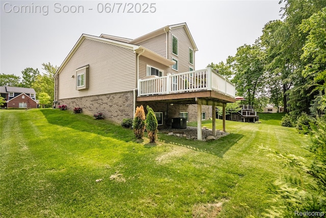 791 Glen Meadows Dr, South Lyon, MI 48178 - rear view of house featuring brick siding, a wooden deck, central air condition unit, and a lawn
