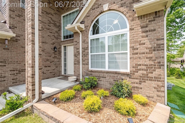 791 Glen Meadows Dr, South Lyon, MI 48178 - property entrance with brick siding