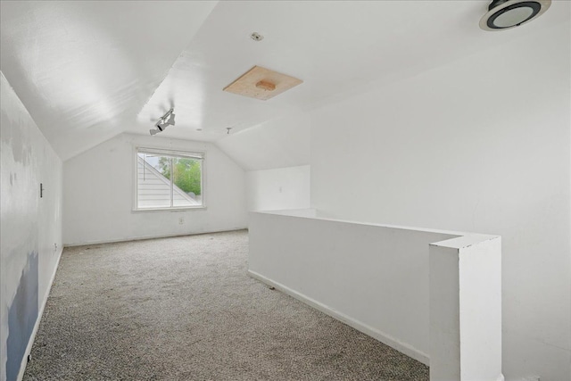 21803 Brittany Ave, Eastpointe, MI 48021 - additional living space featuring vaulted ceiling, carpet floors, and baseboards