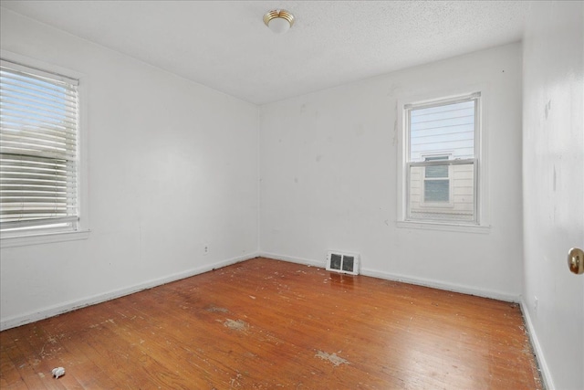 21803 Brittany Ave, Eastpointe, MI 48021 - unfurnished room featuring hardwood / wood-style floors and plenty of natural light