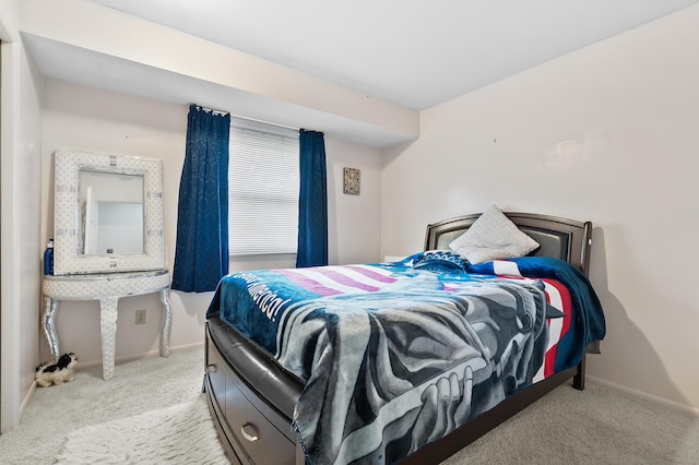 carpeted bedroom featuring baseboards