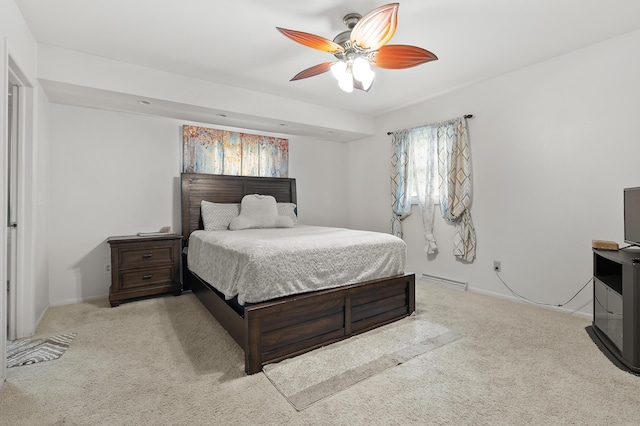 carpeted bedroom with a ceiling fan, baseboards, and baseboard heating