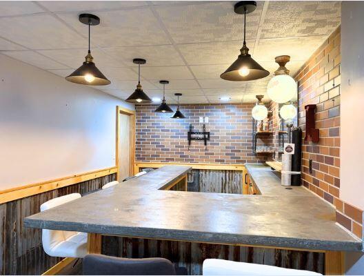 kitchen with brick wall and decorative light fixtures