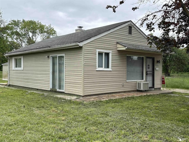 12642 Kentfield St, Detroit, MI 48223 - rear view of house with a yard, a chimney, and a shingled roof
