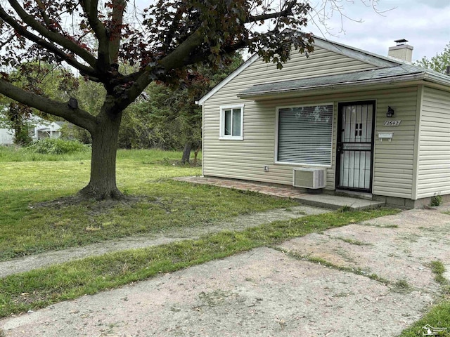 12642 Kentfield St, Detroit, MI 48223 - view of front of house with a chimney and a front yard