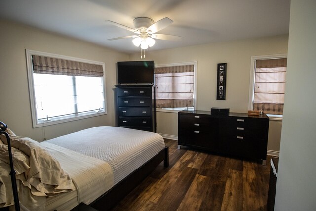 13496 S Horrell Rd, Fenton, MI 48430 - bedroom with dark wood-style flooring and a ceiling fan