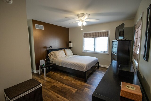 13496 S Horrell Rd, Fenton, MI 48430 - bedroom with dark wood-style floors, ceiling fan, and baseboards
