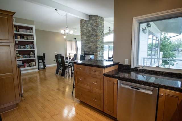13496 S Horrell Rd, Fenton, MI 48430 - kitchen with dishwasher, a chandelier, brown cabinetry, and healthy amount of natural light
