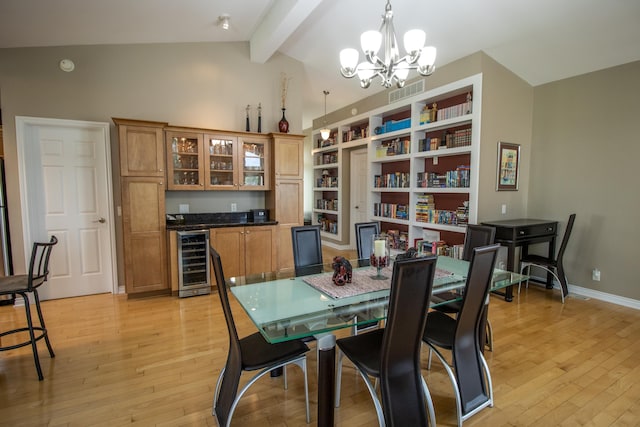 13496 S Horrell Rd, Fenton, MI 48430 - dining room with beverage cooler, light wood-style floors, a chandelier, bar, and baseboards