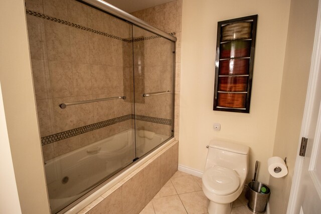 13496 S Horrell Rd, Fenton, MI 48430 - bathroom with tiled shower / bath combo, tile patterned floors, toilet, and baseboards