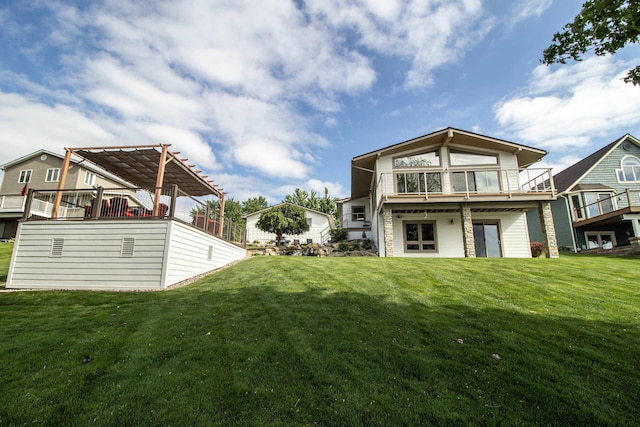 13496 S Horrell Rd, Fenton, MI 48430 - rear view of house featuring a lawn, a pergola, and a wooden deck