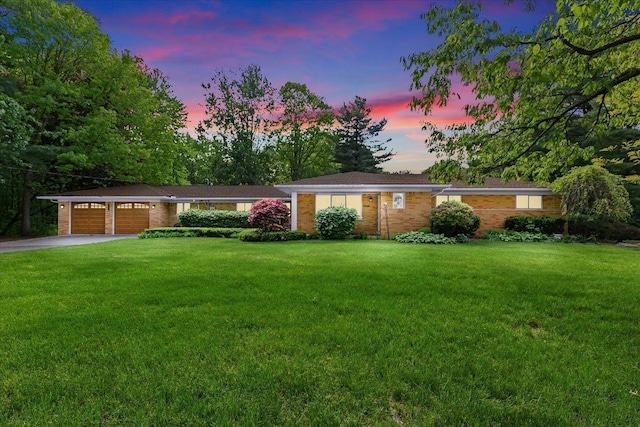 52851 Fairchild Rd, Chesterfield, MI 48051 - ranch-style house featuring driveway, a garage, a lawn, and brick siding