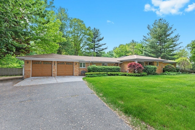 52851 Fairchild Rd, Chesterfield, MI 48051 - ranch-style house featuring an attached garage, asphalt driveway, and brick siding