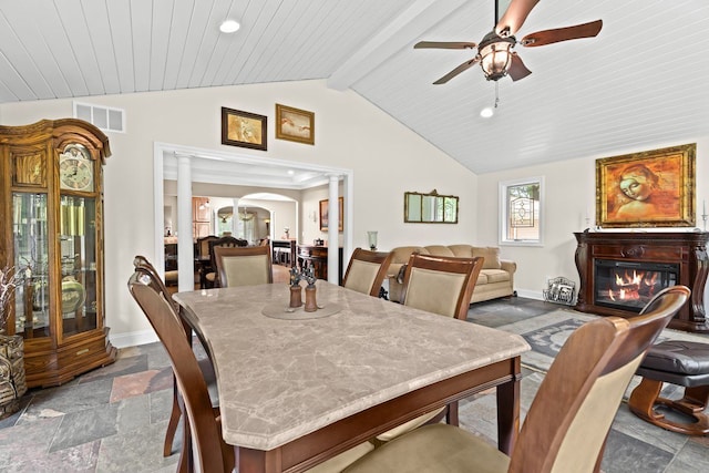 52851 Fairchild Rd, Chesterfield, MI 48051 - dining area with stone tile flooring, baseboards, a ceiling fan, a glass covered fireplace, and recessed lighting