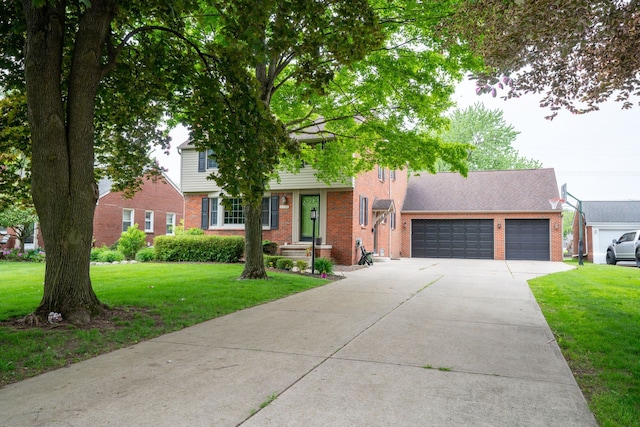 2366 Grange Rd, Trenton, MI 48183 - view of front facade with brick siding, concrete driveway, a front yard, and a garage