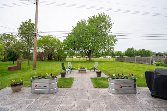 2366 Grange Rd, Trenton, MI 48183 - view of patio featuring an outdoor fire pit