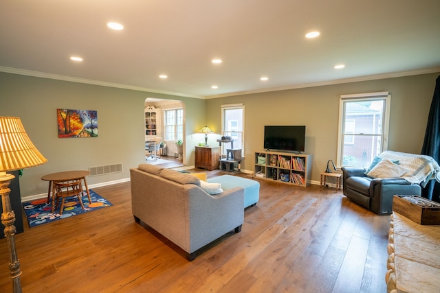 2366 Grange Rd, Trenton, MI 48183 - living room featuring crown molding, wood finished floors, recessed lighting, healthy amount of natural light, and baseboards
