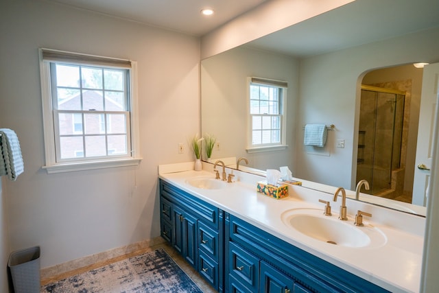 2366 Grange Rd, Trenton, MI 48183 - full bath featuring a shower stall, double vanity, baseboards, and tile patterned flooring