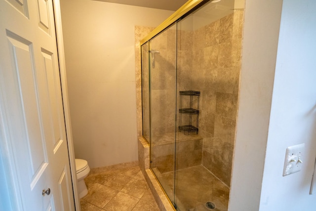 2366 Grange Rd, Trenton, MI 48183 - bathroom featuring a stall shower, toilet, and tile patterned floors