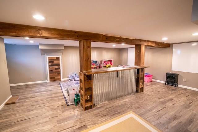 2366 Grange Rd, Trenton, MI 48183 - indoor bar with a wood stove, light wood-type flooring, beam ceiling, recessed lighting, and baseboards