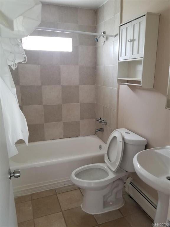 7267 William St, Taylor, MI 48180 - bathroom featuring shower / tub combo, toilet, a baseboard radiator, and tile patterned floors