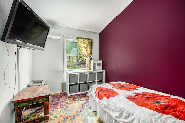 bedroom with carpet floors, baseboards, and a wall mounted AC
