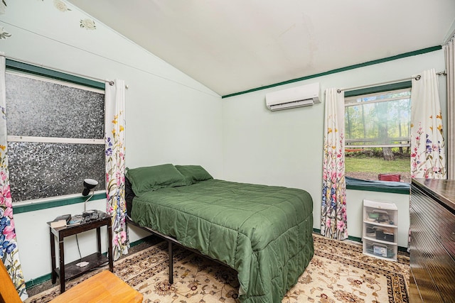 bedroom featuring a wall mounted AC, lofted ceiling, and baseboards