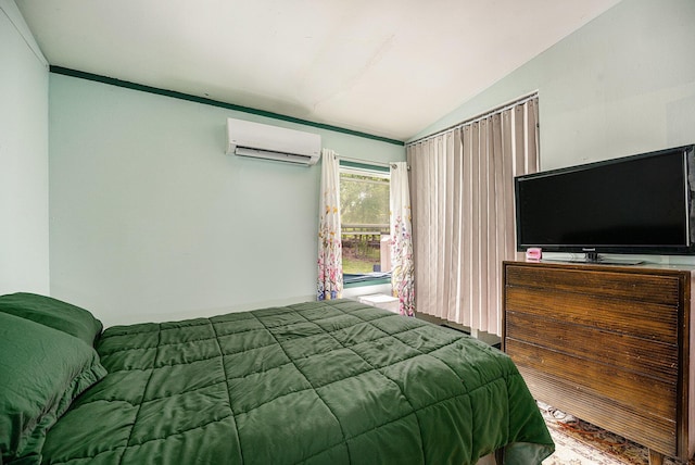 bedroom with a wall unit AC and vaulted ceiling