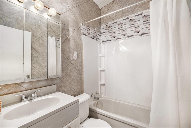 full bathroom featuring tile walls, toilet, shower / bathtub combination with curtain, and vanity